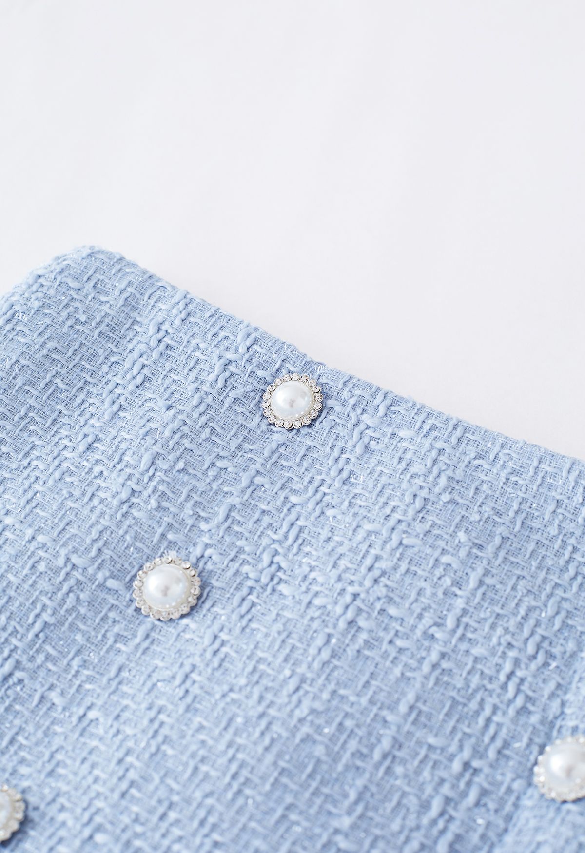 Zweireihiger, plissierter Tweed-Minirock in Blau