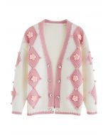 Strickjacke mit Bommeln in Rosa und Blumenmuster